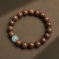 Golden Silk Wood Bracelet with Light Green Jade