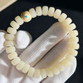 White Bodhi Flat Bead Bracelet with Ivory Nut Accent